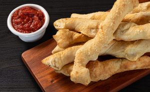 Order Twisted Breadstix food online from Pizza Factory store, Show Low on bringmethat.com